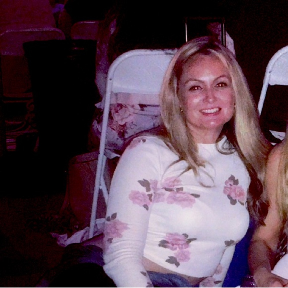 Floral, long-sleeve crop top.  Henley style.  Off-white with pink accents. Cute!